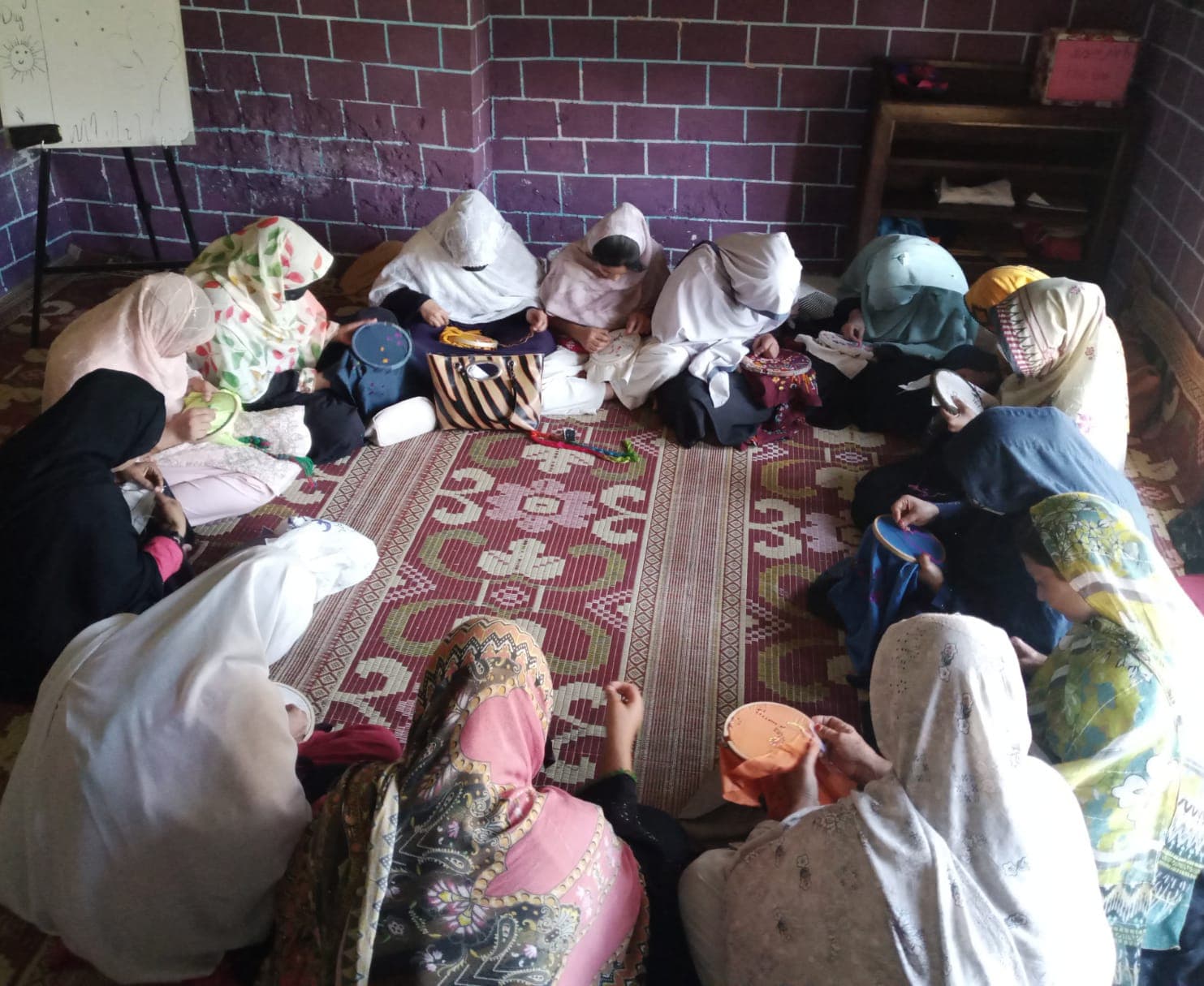 Trainees sewing at machines during a class at Da Hunar Stori Vocational Training Centre